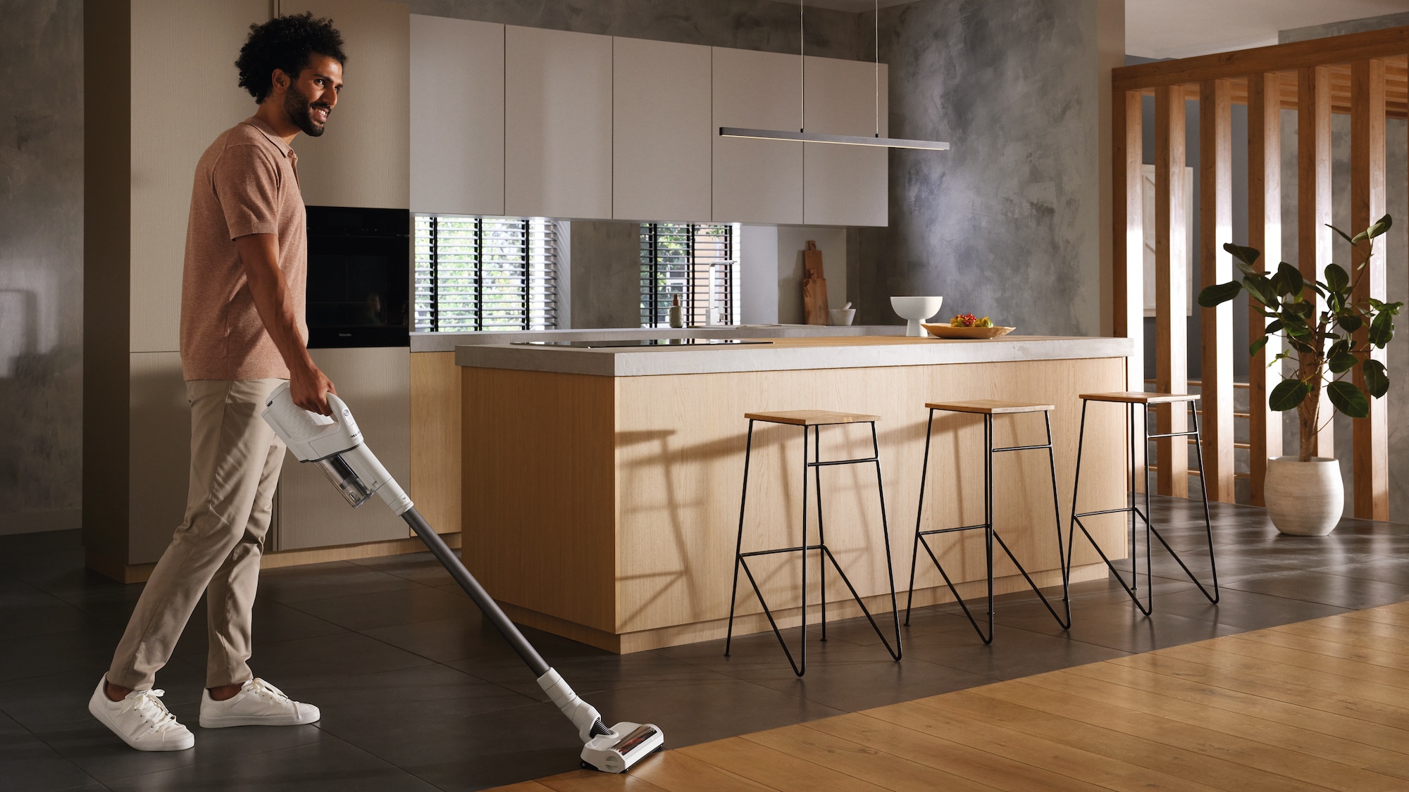 Image of a man vacuuming