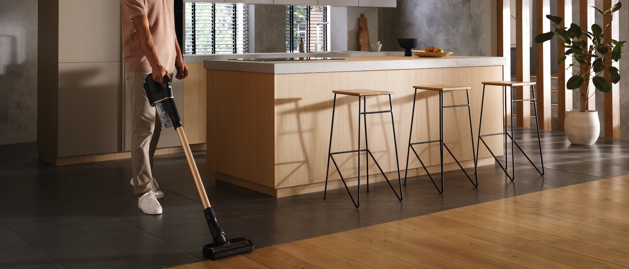 Image of a man vacuuming