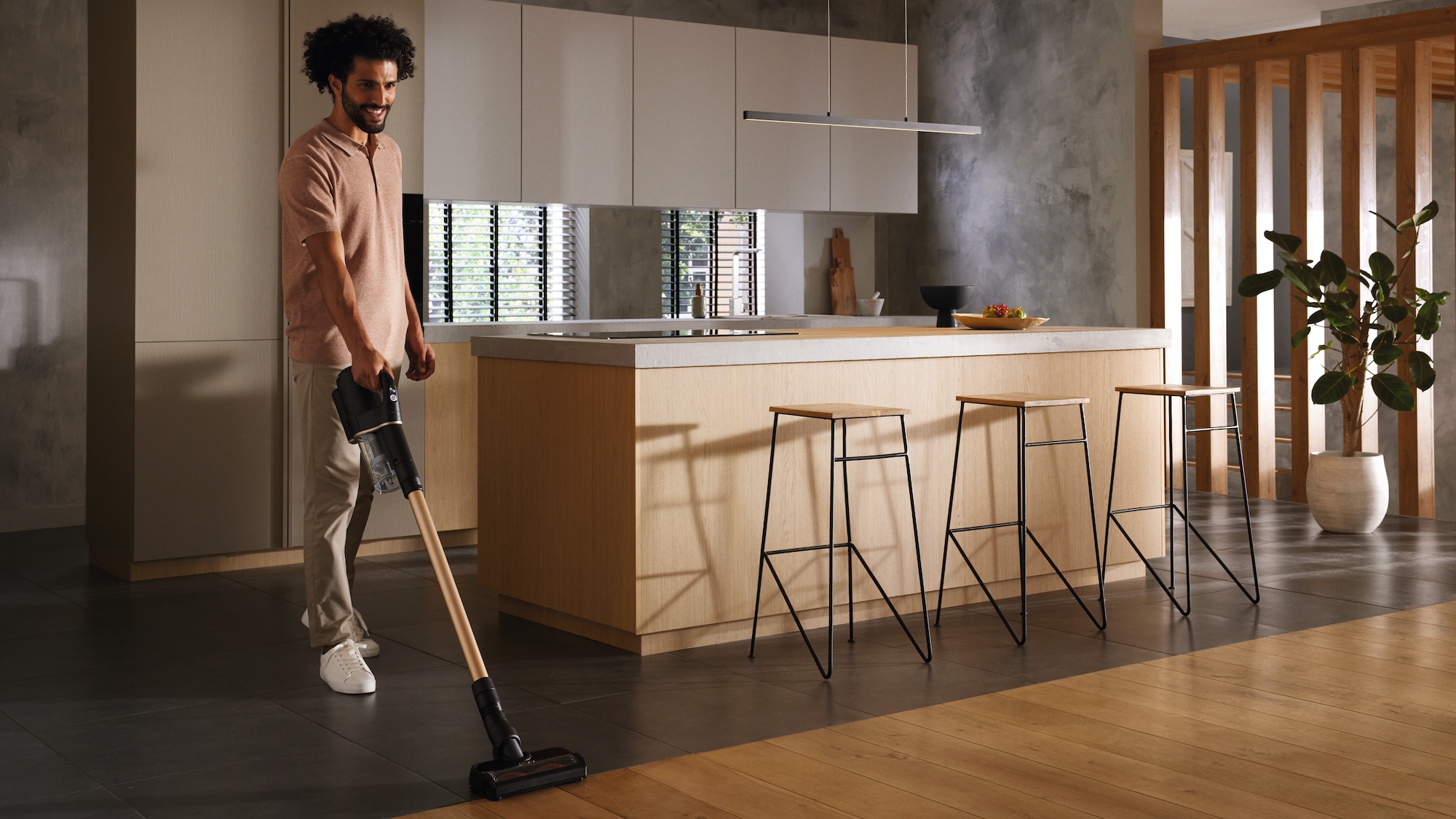 Image of a man vacuuming