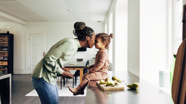 Image of a woman and a child in the kitchen