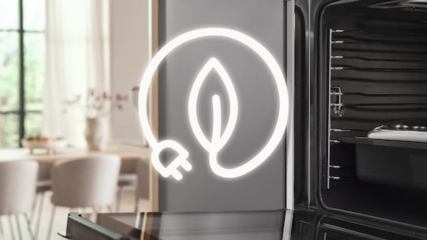 Miele oven open and next to it a sustainability symbol