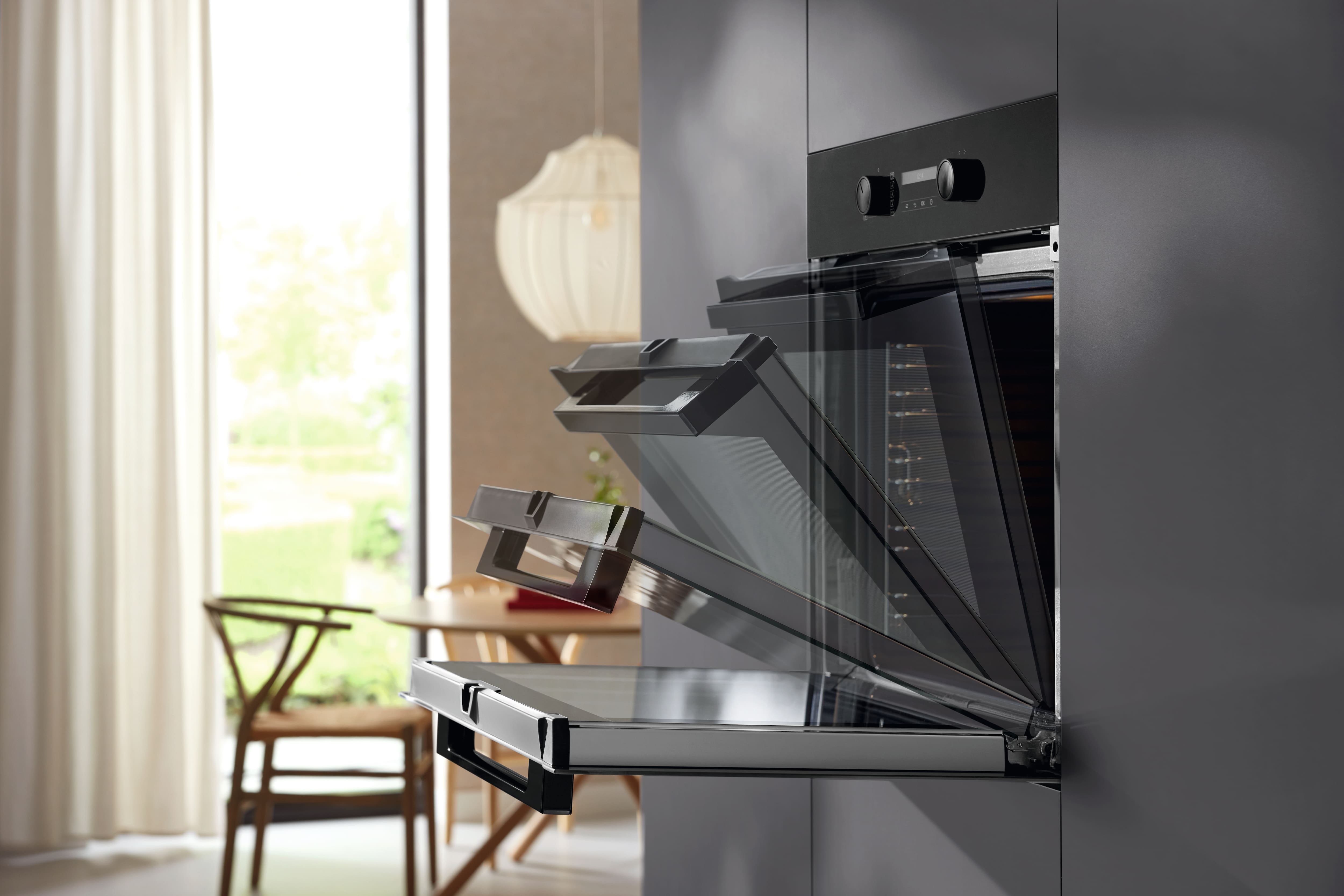A Miele oven being opened