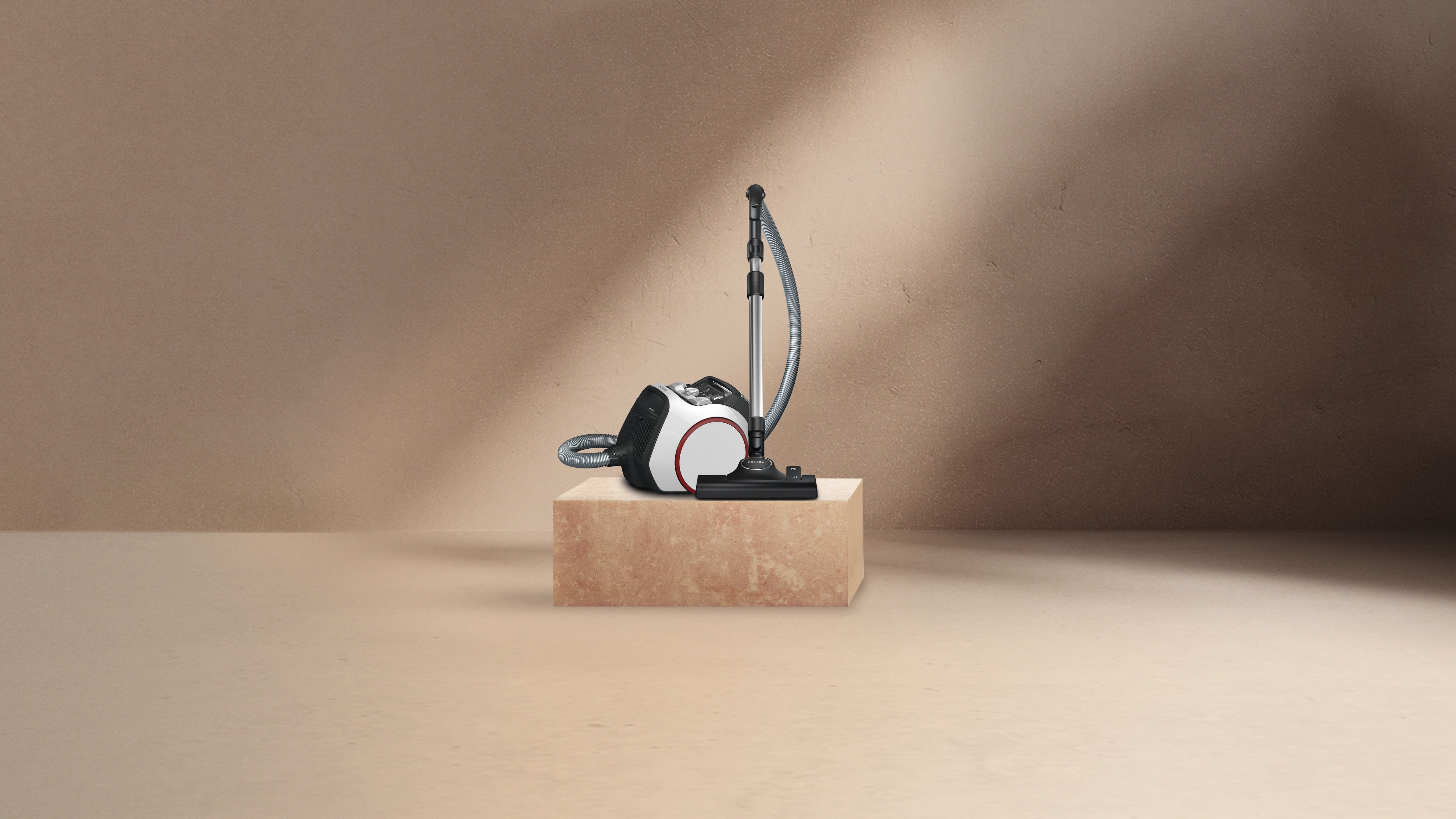 A Miele vacuum cleaner on a pedestal A Miele vacuum cleaner on a pedestal