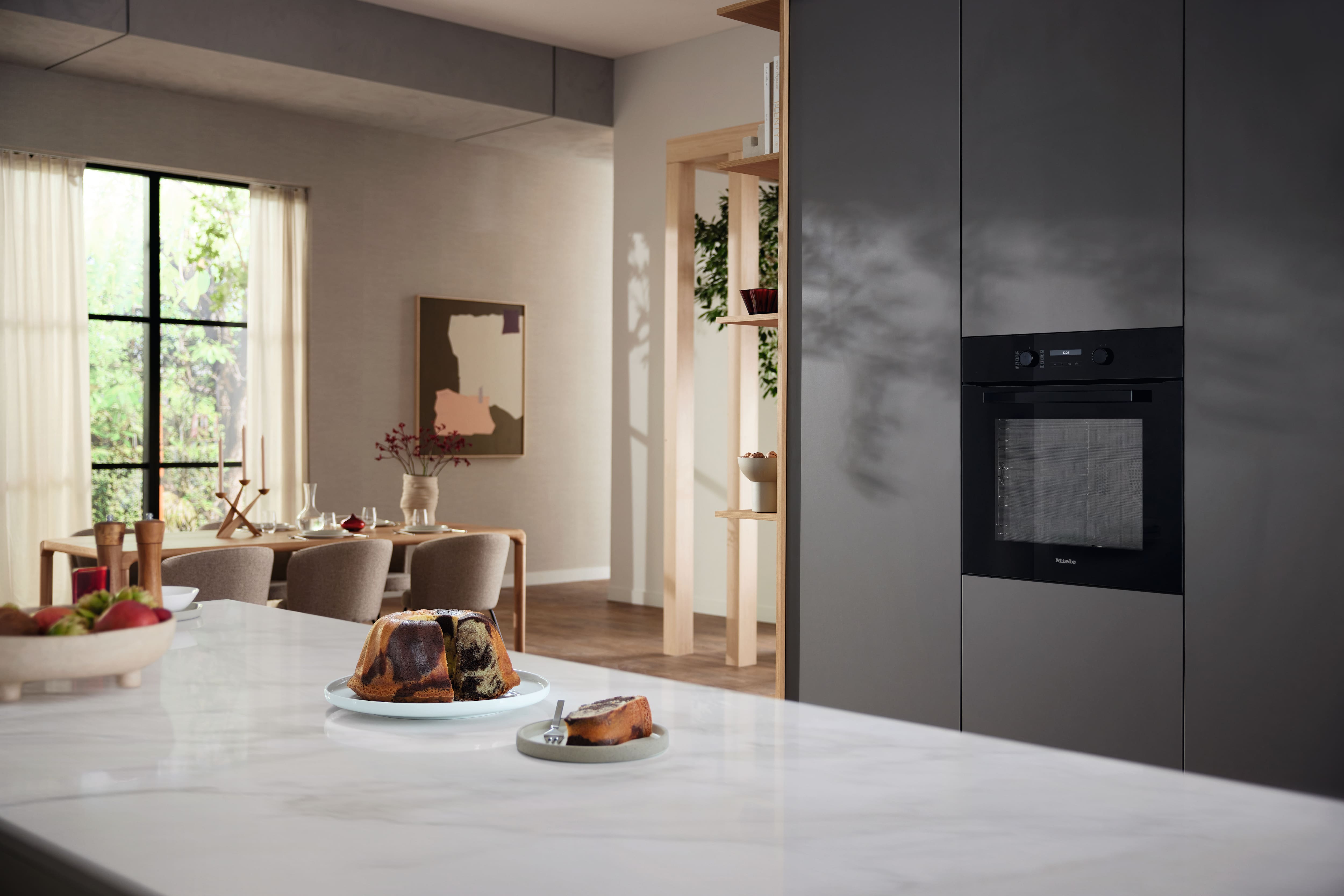 Modern kitchen setting with Miele obsidian black appliances