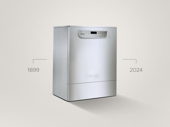 Uma máquina de lavar e desinfetar em aço inoxidável da série PG 85 sobre um fundo cinzento.