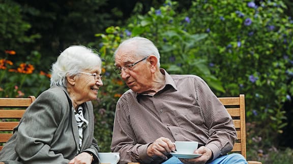 Aged couple on the garden bench