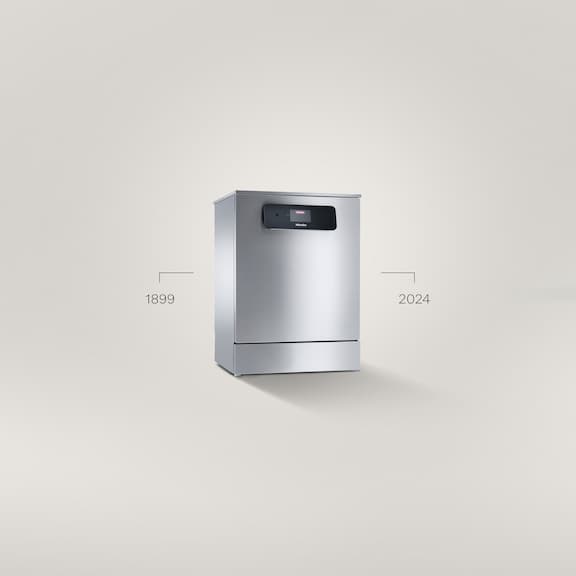 Eine MasterLine Frischwasser-Spülmaschine steht auf einem grauen Hintergrund