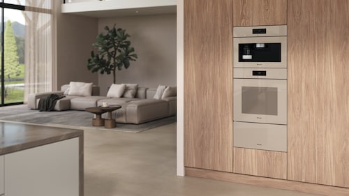 Pearl beige appliances in a light wood kitchen