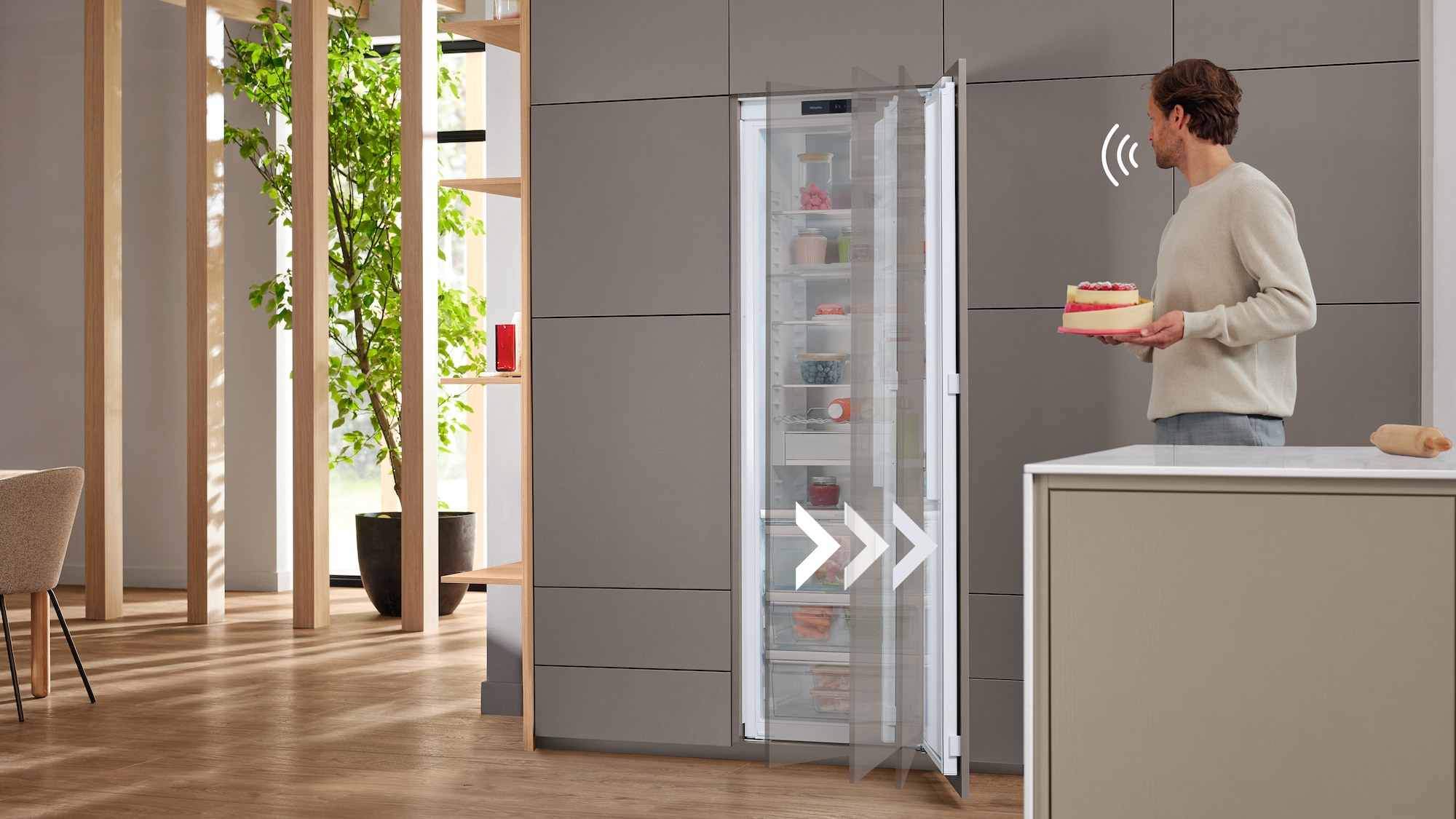 laundry room with hanged shirts and Miele washing machine