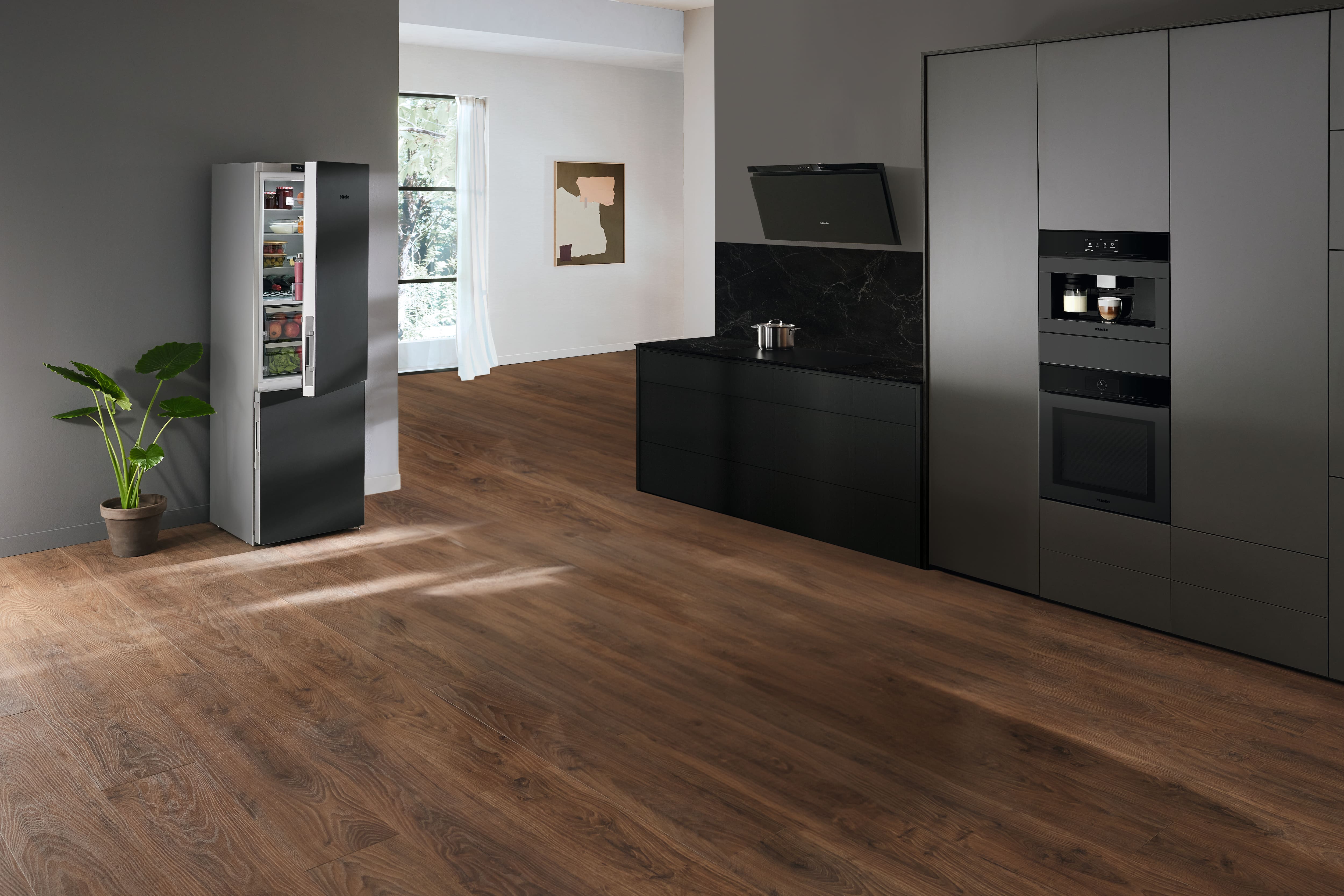 Open kitchen setting with multiple Miele appliances