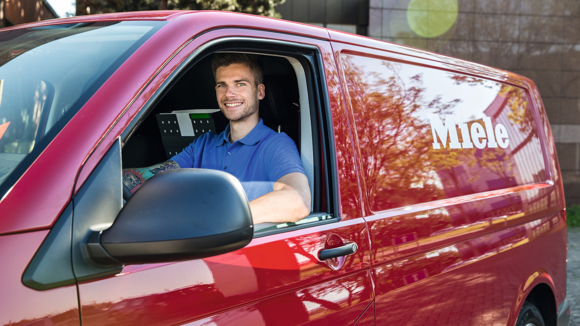 on a white table there is money in front of a plant, an hourglass and a white napkin