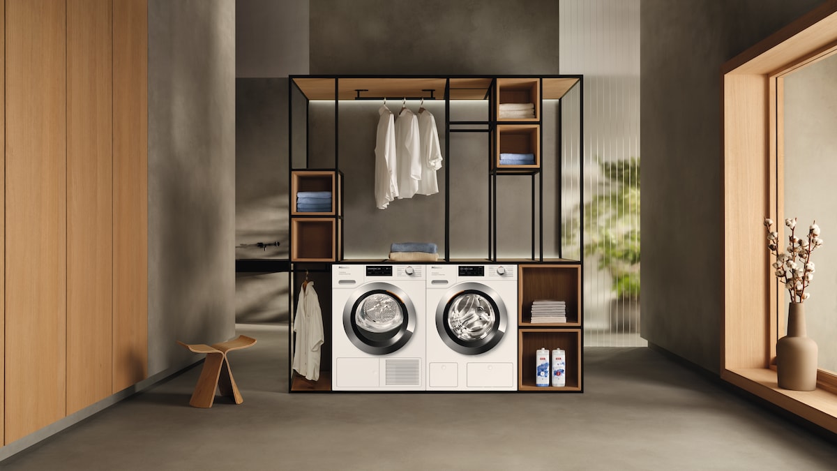 laundry room with Miele washing machine and Miele dryer