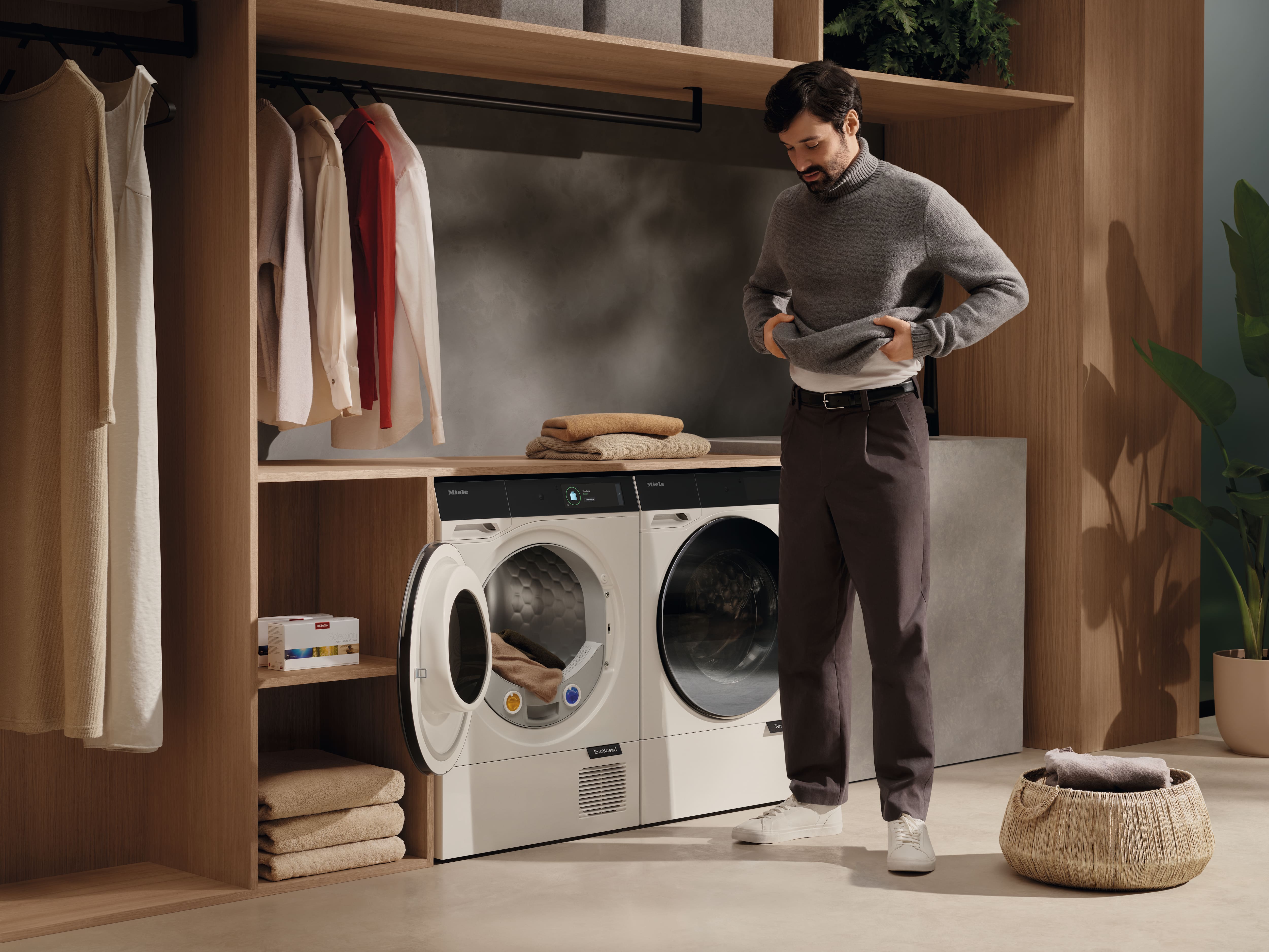 man looking down at Miele Tumble Dryers