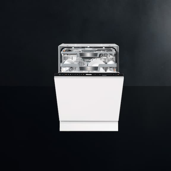 The Miele SmartBiz freshwater dishwasher PFD 104 SCVi is displayed on a black background.