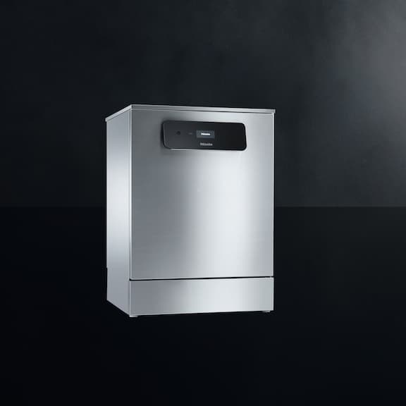 The Miele MasterLine freshwater dishwasher PFD 400 is displayed on a black background.