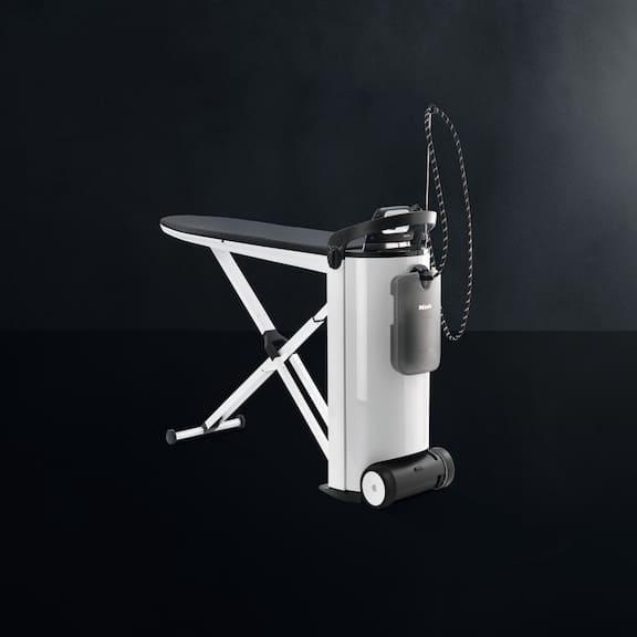 The Miele steam ironing system PIB 100 is displayed on a black background.