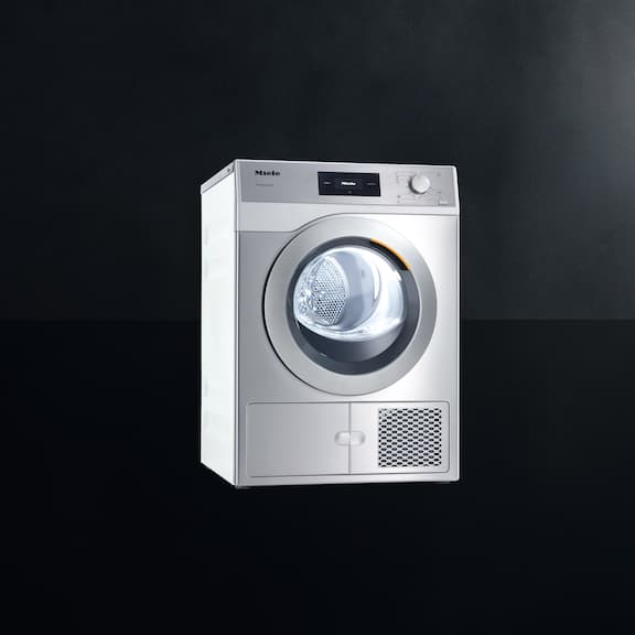 The Miele Little Giant heat pump dryer PDR 508 HP is displayed on a black background.