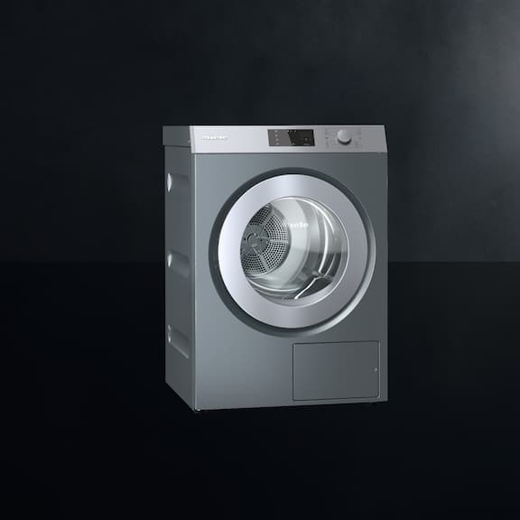 The Miele Benchmark Performance dryer PDR 510 is displayed on a black background.