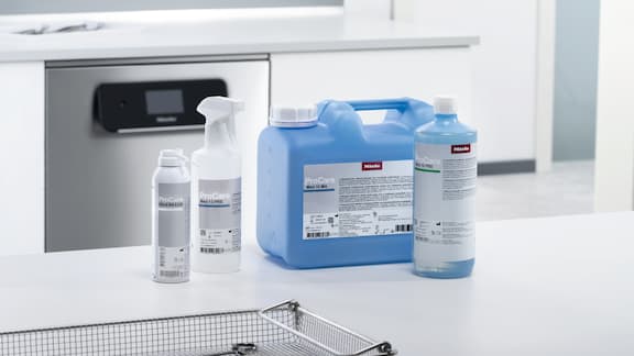Close-up of Miele ProCare Med process chemicals in front of ExpertLine washer disinfector