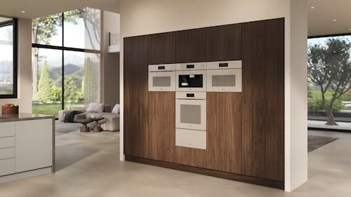 Pearl beige appliances in a dark wood kitchen