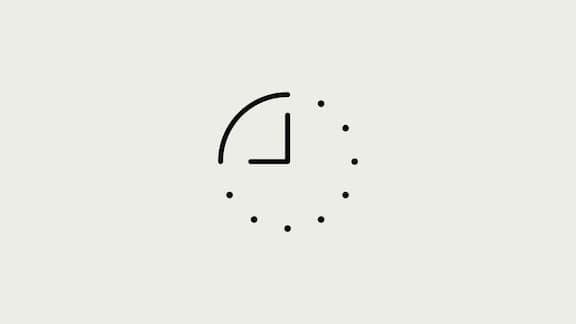 A black icon of a clock on a grey background.