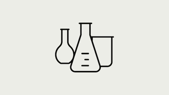 An Erlenmeyer flask, a beaker and a round flask as an icon drawing on a grey background.