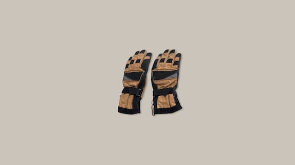 Firefighter gloves against a plain grey background