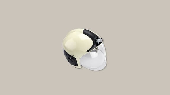 A black and white firefighter's helmet on a plain grey background