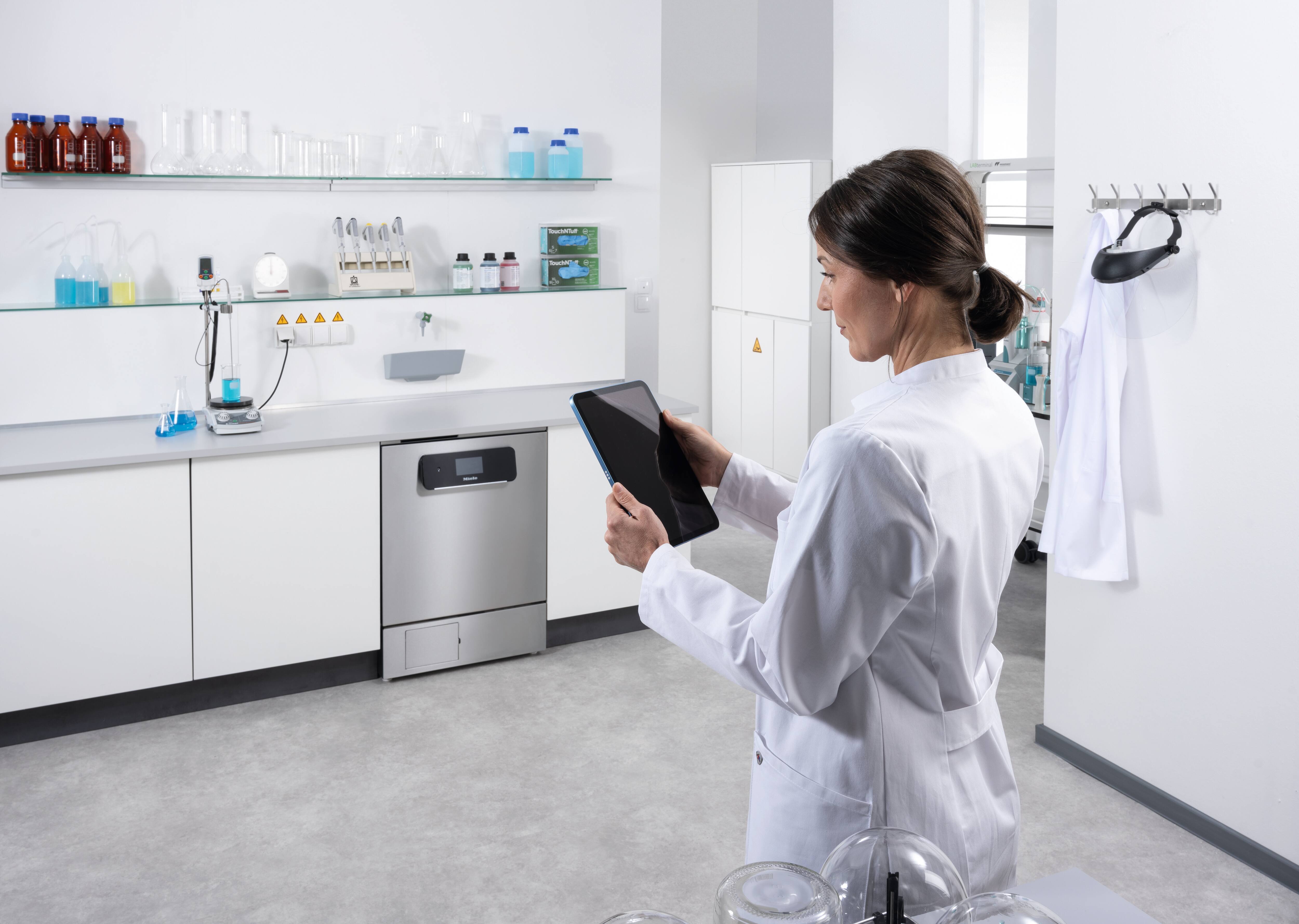 A lab technician using Miele MOVE