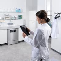 A lab technician using Miele MOVE