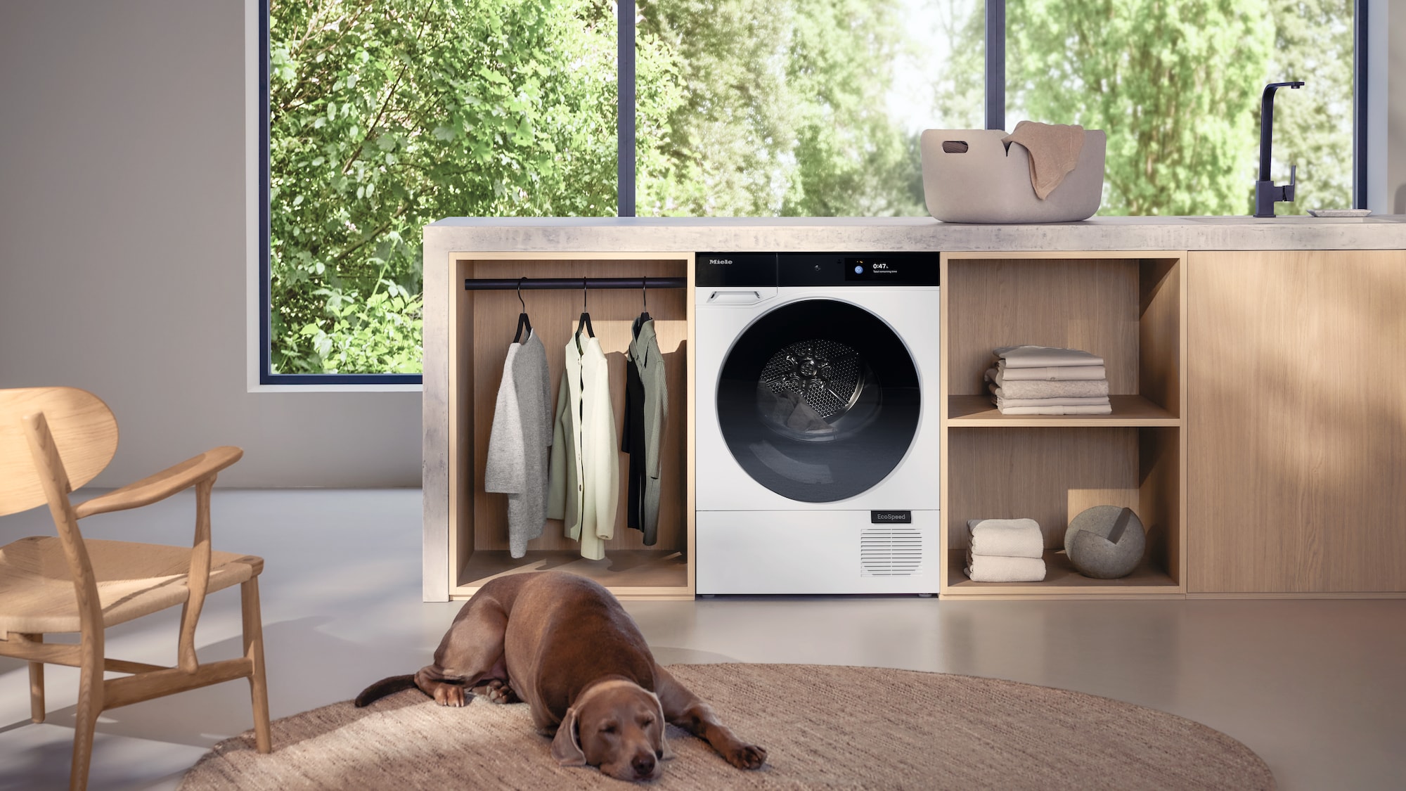 a man turning on a Miele dryer