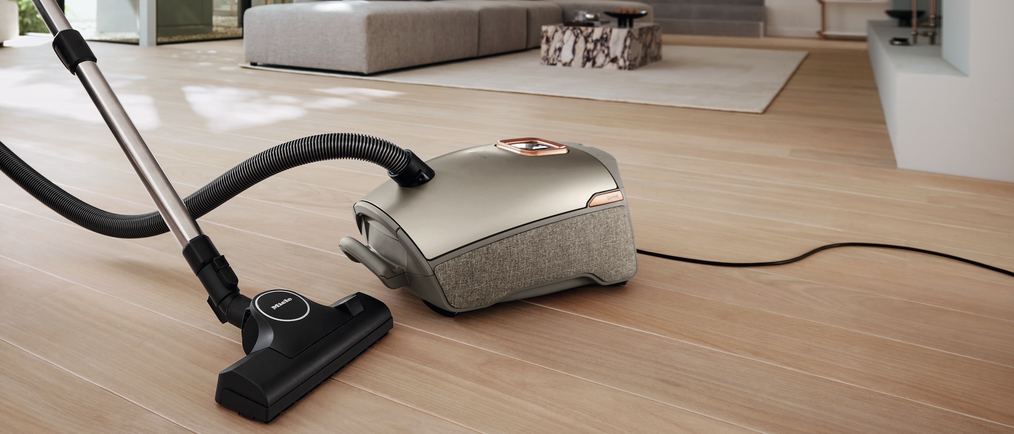 Miele vacuum cleaner next to a dog
