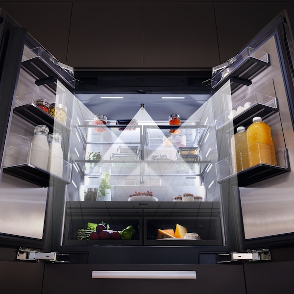 Detailed view of the new MasterCool refrigerator with its doors opened, front-facing, showcasing the placement of the built-in cameras. One sits in the main center part at the top, and the other two are placed at the top of each door.