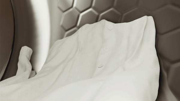 miele dryer in work with a white shirt inside