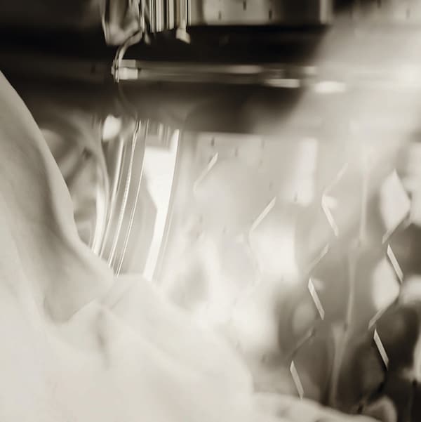 white clothes being steamed in miele washing machine