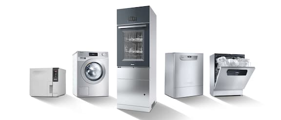 Group photo with Miele Professional machines, including a washing machine, dishwasher, laboratory washers and washer-disinfector.