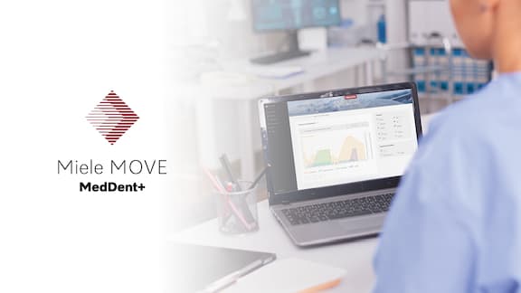 An employee operates a laptop using Miele MOVE MedDent+.