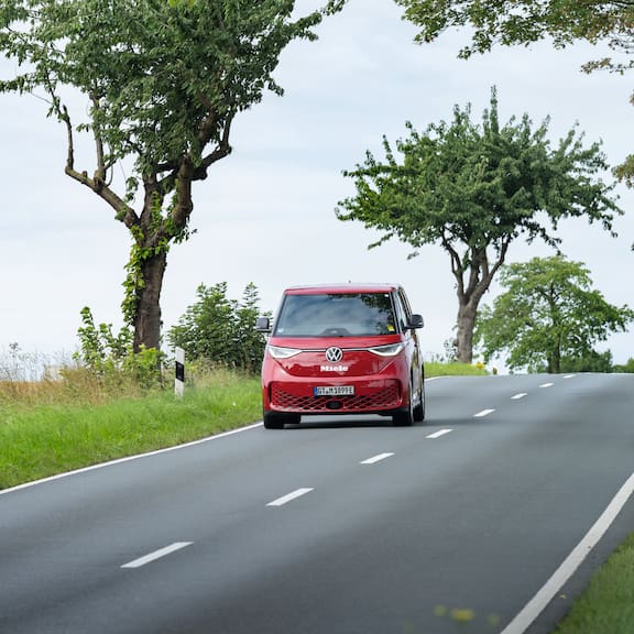 Red service van on the road – represents PROtect and professional services.