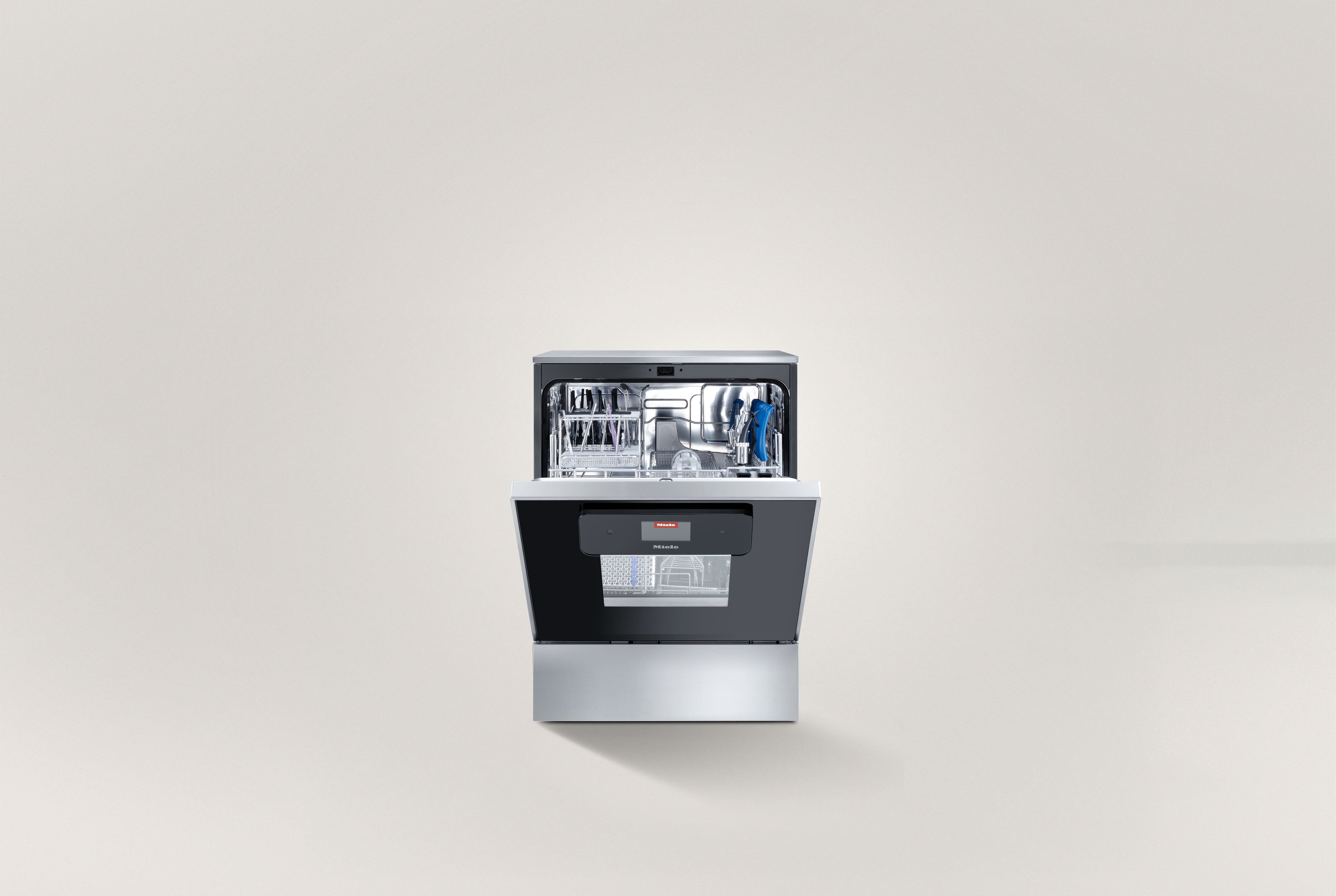 ExpertLine thermal disinfector half open with dental instruments inside