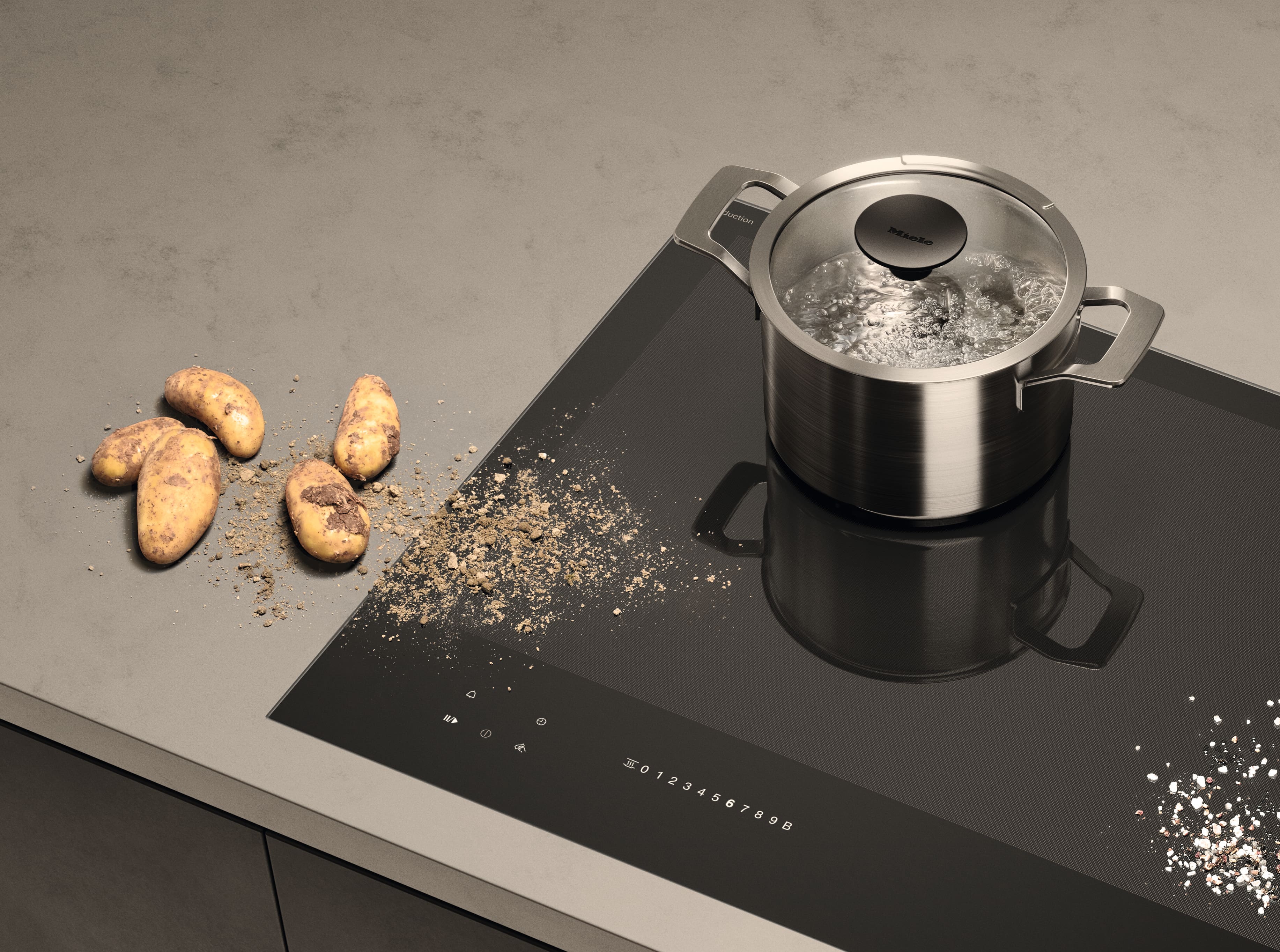 Top view of a hob with a pot of boiling water, some potatoes with skin remains spreading over the hob