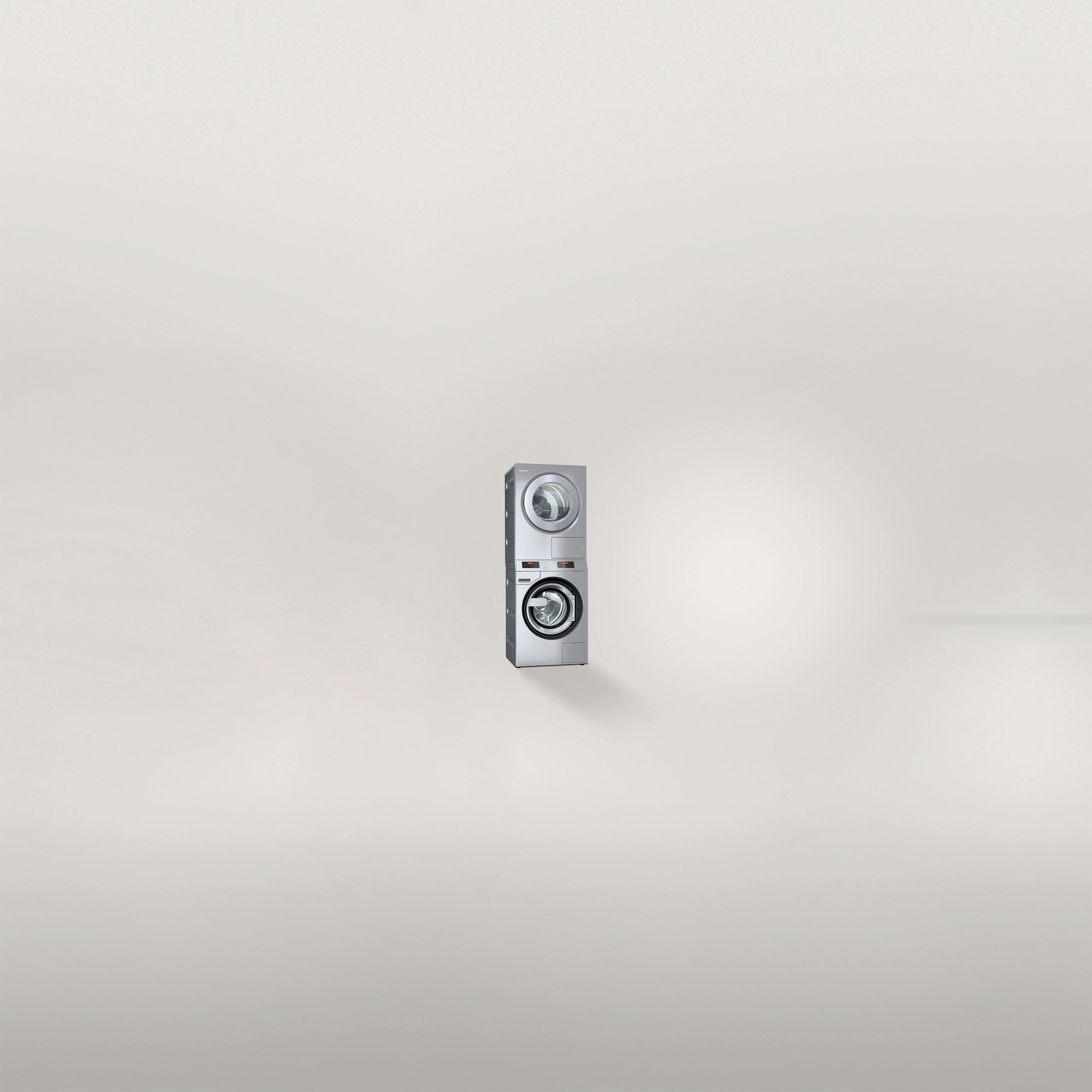 Miele Professional Benchmark PWM 912 washing machine against a neutral background. 