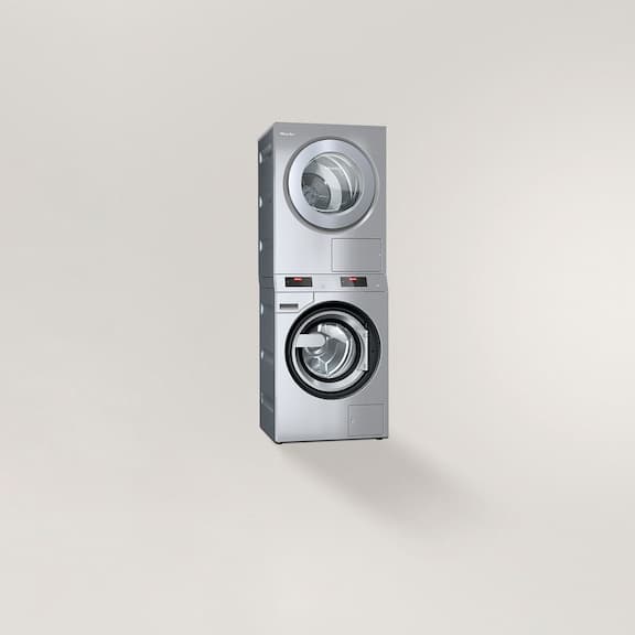A washer-dryer stack on a grey background
