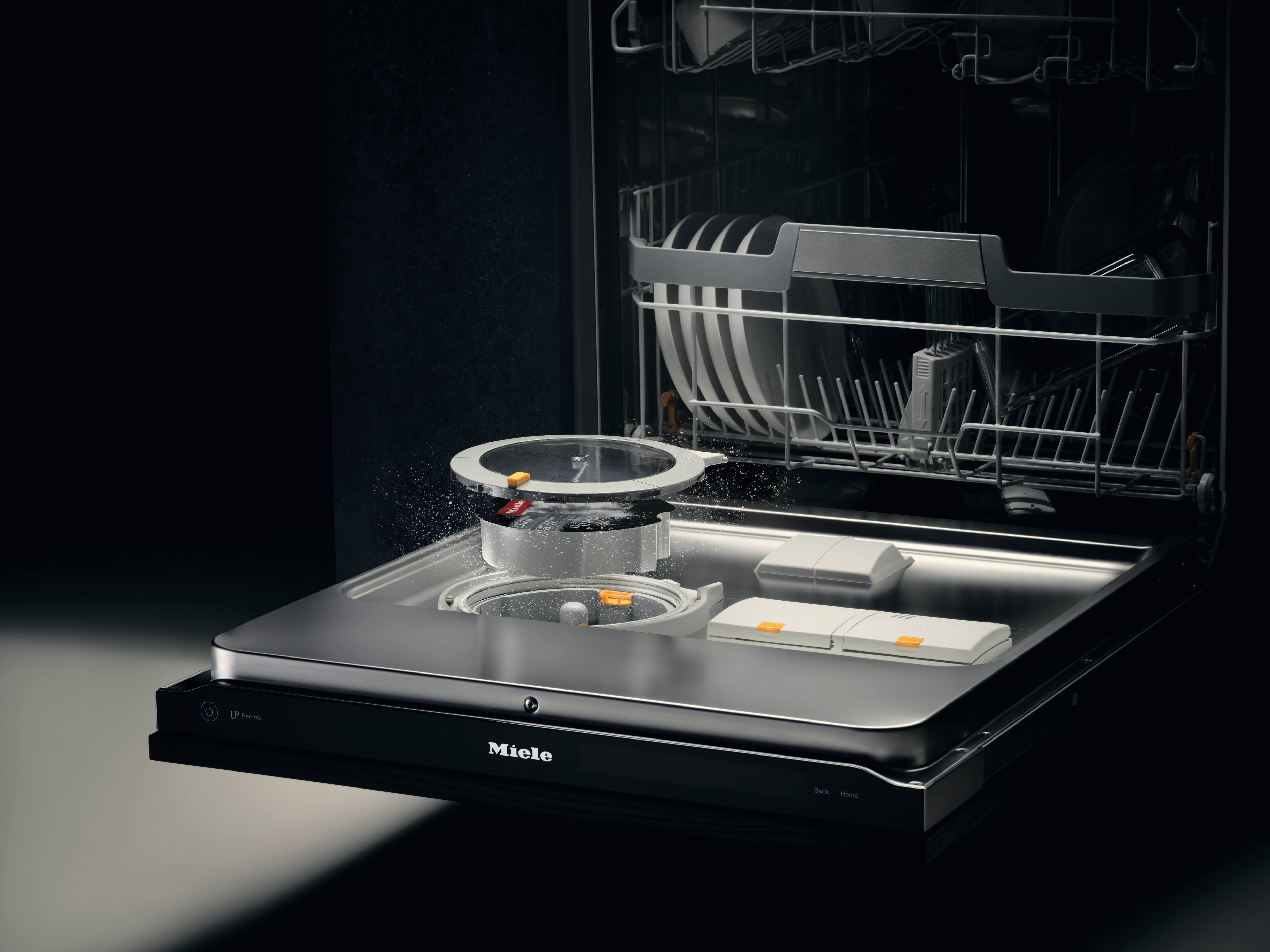 Opened dishwasher with the PowerDisk coming out in CGI to showcase where it sits in the machine