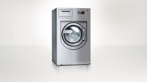 Miele Professional Benchmark PWM 912 washing machine against a neutral background.