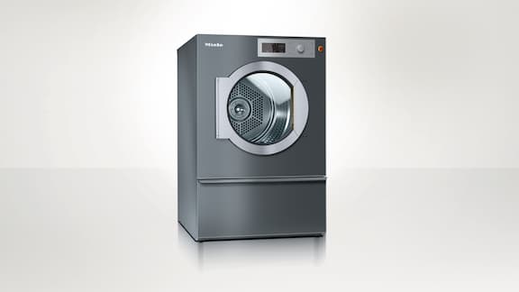 Miele Professional Benchmark PDR 514 tumble dryer against a neutral background. 