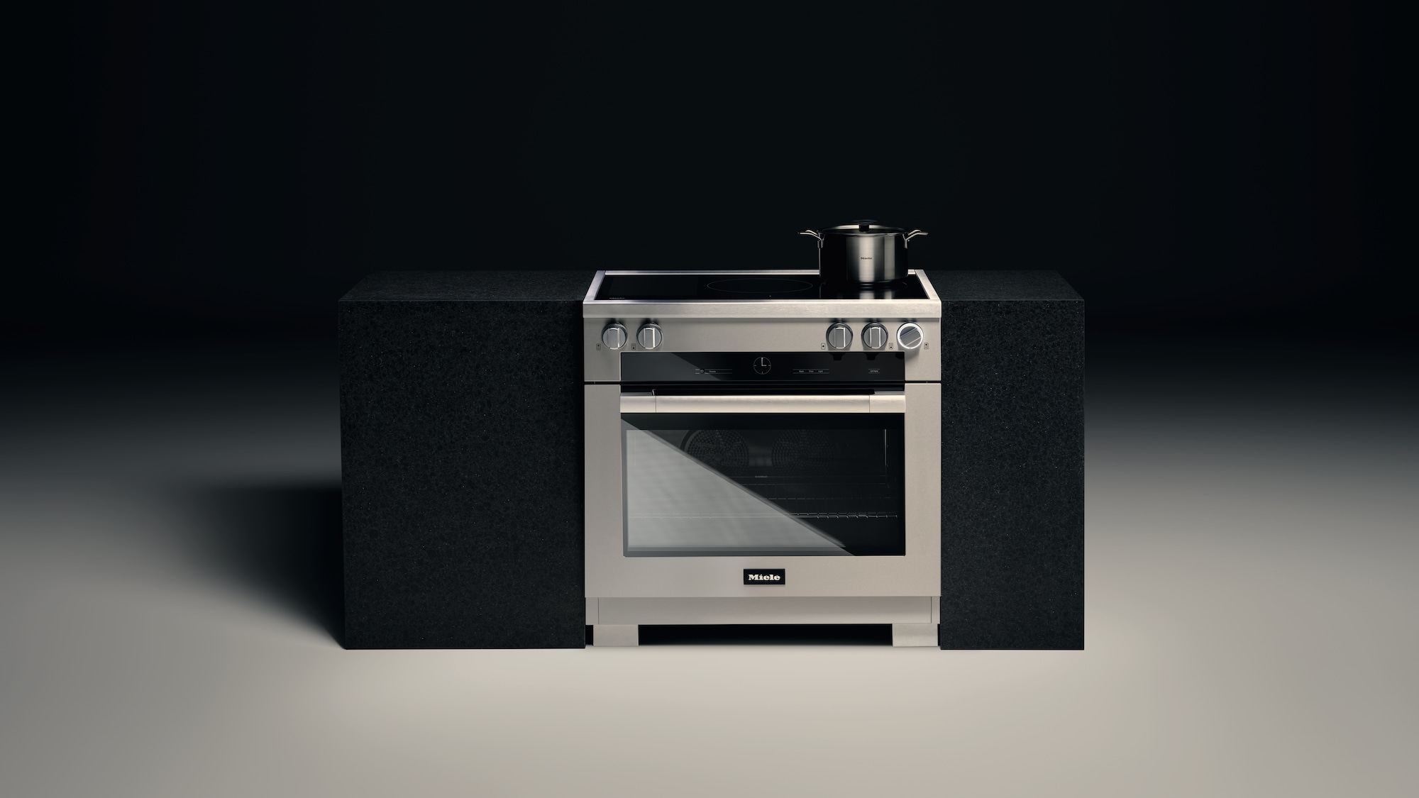 Miele Induction Range standing alone in a dark background setting