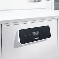 Myjnia laboratoryjna ze stali szlachetnej z czarnym panelem sterowania i wyświetlaczem, na którym widoczne są ikony.