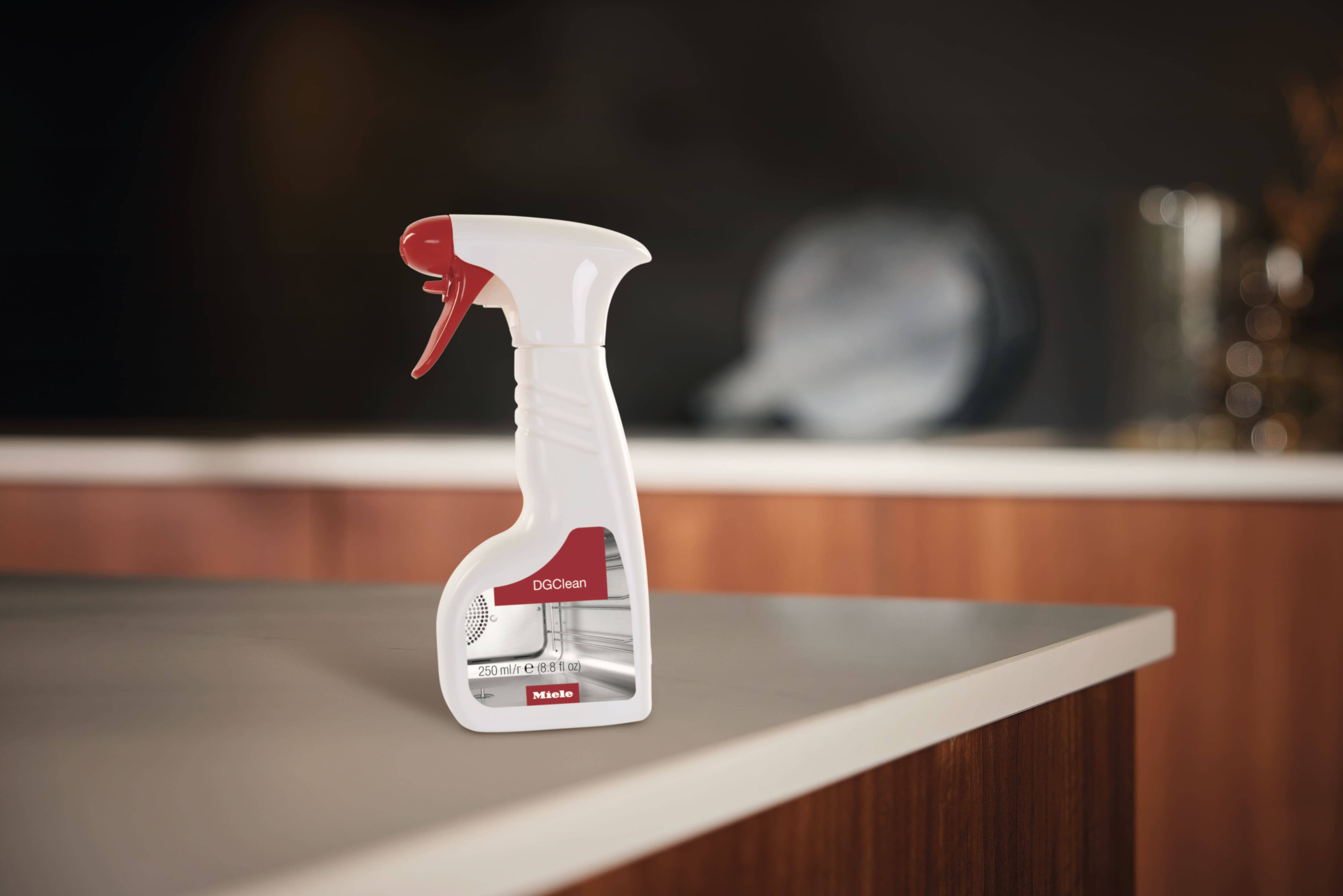 Miele DGClean spray bottle displayed on top of a kitchen counter top