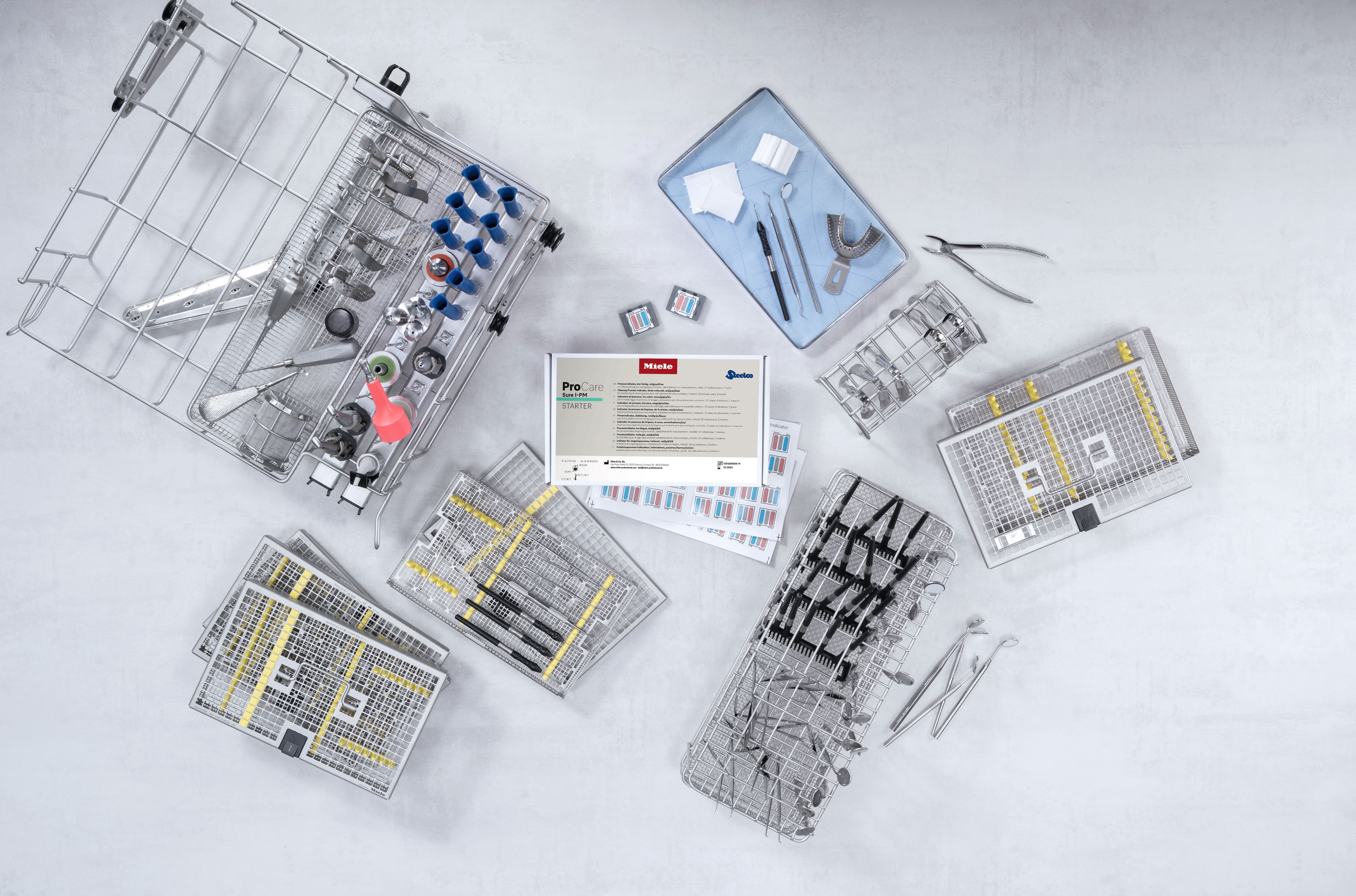 ProCare Sure I-PM entouré d’instruments dentaires.