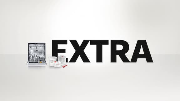 Promo for Miele Professional: 2 commercial machines – SlimLine PLW 7111 laboratory washer and ExpertLine PLW 8693 laboratory washer – against a neutral background. The lettering “EXTRA” appears above it in large black letters.